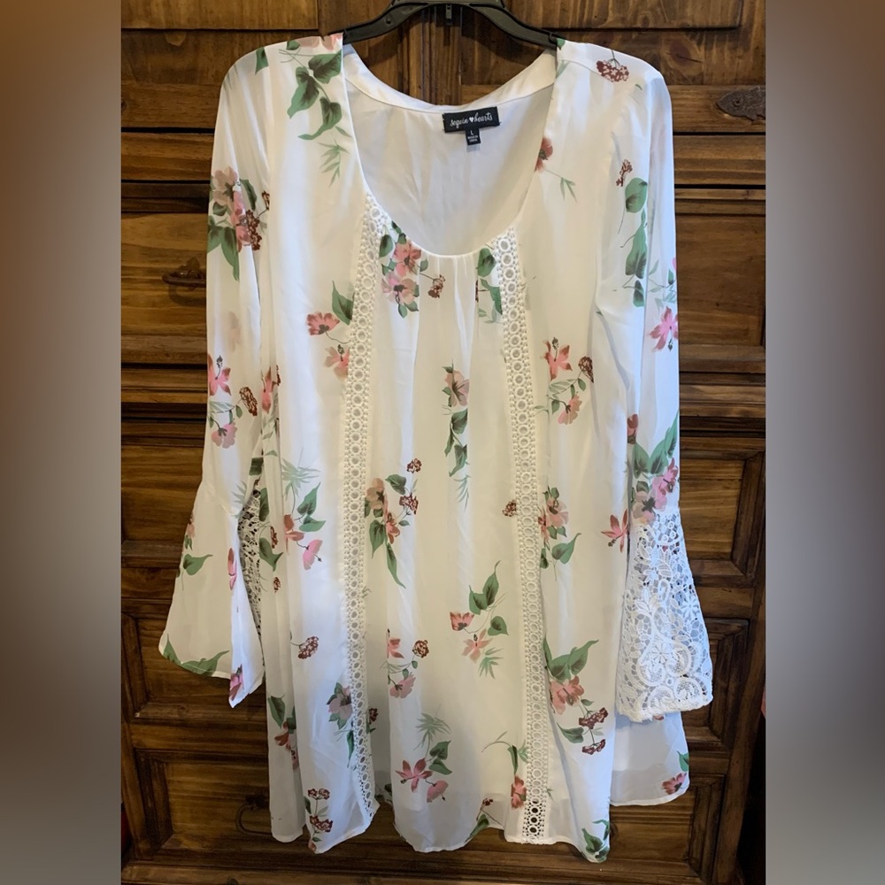 Large white dress with pink flowers made by Sequin hearts.